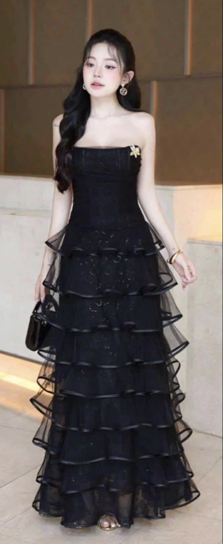 Black strapless tiered ruffle maxi dress (Category: Dresses) located in Quezon City. Submitted by shopwithfrance (Listing ID 1468906438, Image 1). Description: Stunning black strapless maxi dress with a glitter finish, fitted bodice, and tiered ruffles. Worn once and dry cleaned. Perfect for evening events! Got so much compliments. It’s really a gown-gown..