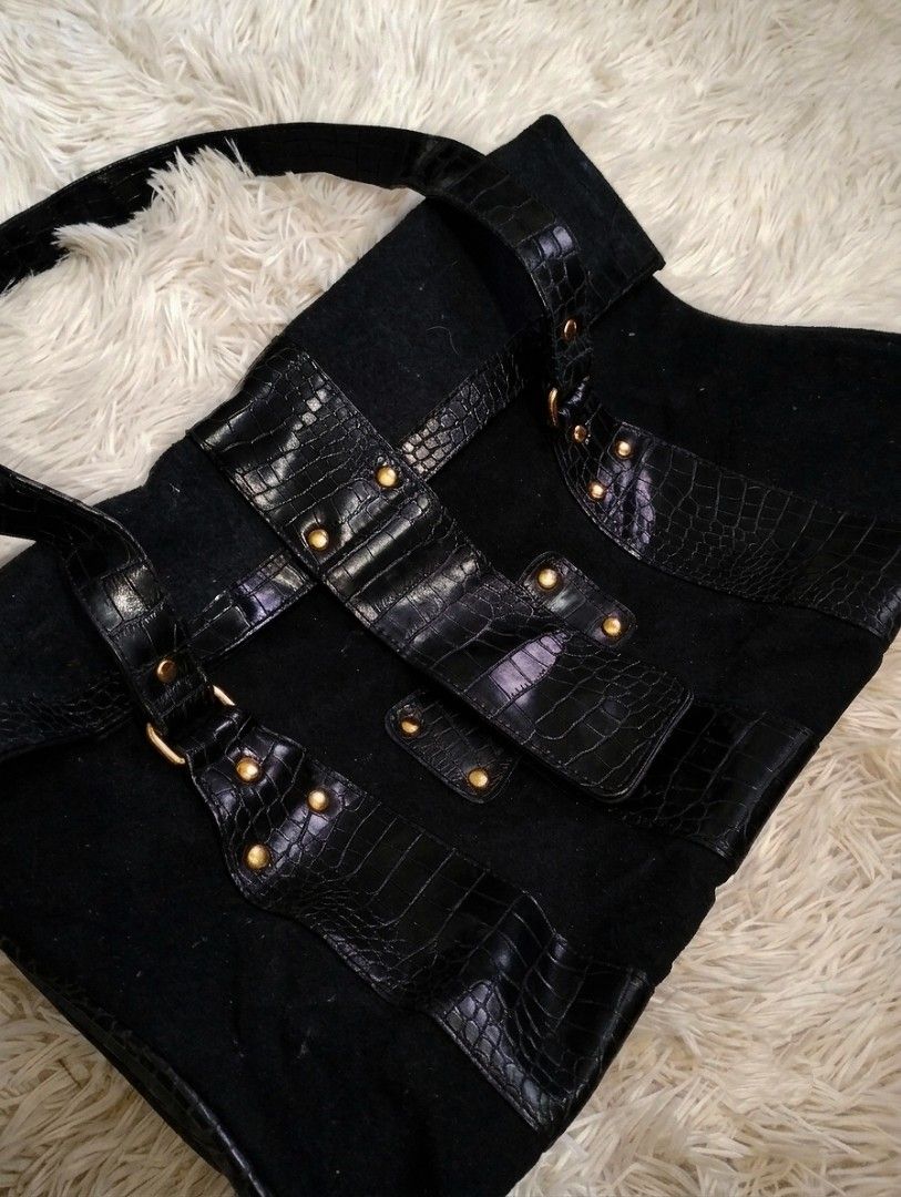 Black Tote Bag with Crocodile Embossed Trim and Studs (Category: Tote Bags) located in Manila. Submitted by littlenicsfinds (Listing ID 1468741255, Image 1). Description: - Style: Black fabric tote with glossy croc-embossed faux leather panels - Hardware: Gold-tone studs and buckle accents on straps - Design: Structured bottom base with matching croc pattern - Capacity: Spacious interior for daily essentials - Versatility: Perfect size for school