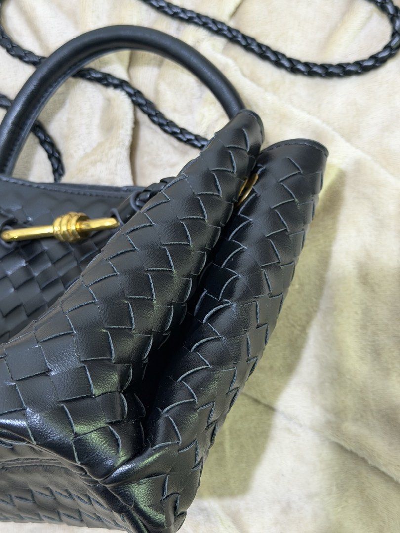 Black woven leather handbag with gold hardware (Category: Luxury Bags & Wallets) located in Manila. Submitted by declutterwtmaan (Listing ID 1468749486, Image 2). Description: - Material: Premium black woven leather with zero scuffs - Hardware: Elegant gold-tone front closure - Straps: Convenient top handles and a stylish braided crossbody strap - Interior: Dark fabric lining equipped with a secure zip pocket - Condition: Clean, well-maintained, 