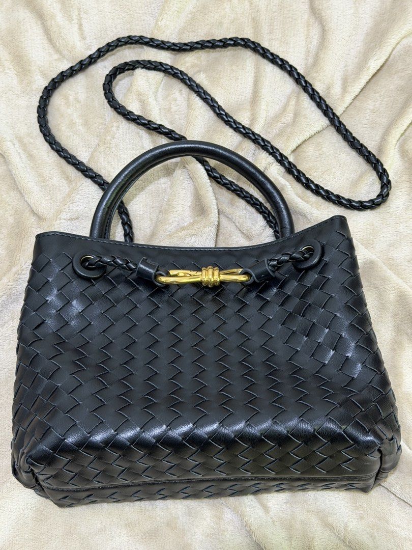 Black woven leather handbag with gold hardware (Category: Luxury Bags & Wallets) located in Manila. Submitted by declutterwtmaan (Listing ID 1468749486, Image 1). Description: - Material: Premium black woven leather with zero scuffs - Hardware: Elegant gold-tone front closure - Straps: Convenient top handles and a stylish braided crossbody strap - Interior: Dark fabric lining equipped with a secure zip pocket - Condition: Clean, well-maintained, 