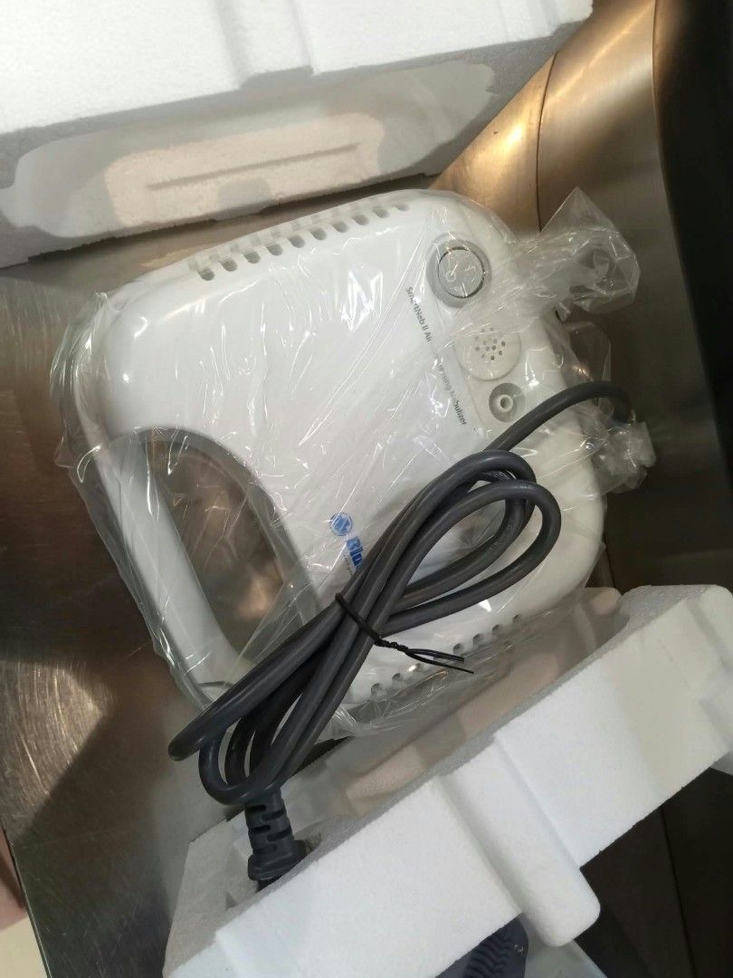 Blue Cross SmartNeb II Air Compressing Nebulizer (Category: Medical Supplies & Tools) located in Pateros City. Submitted by JP0125 (Listing ID 1468831531, Image 3). Description: - Brand: Blue Cross - Model: SmartNeb II Air Compressing Nebulizer - Condition: Brand new, unused, and complete in original box - Inclusions: Main unit in plastic wrap, tubing, medicine cup, user manual, and extra pamphlets - Ideal for: Reliable home respiratory care.