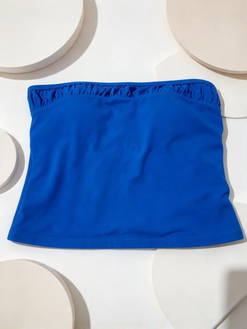 Blue strapless tankini top with built-in padding (Category: Bikinis & Swimsuits) located in Batangas. Submitted by mace2014 (Listing ID 1468712824, Image 2). Description: - Color: Bright royal blue - Style: Strapless tankini top with a clean straight neckline - Support: Built-in nude-colored padded cups for extra coverage and support - Versatility: Great basic piece for swimming, beach trips, or vacations - Condition: Like new/Excellent quality.