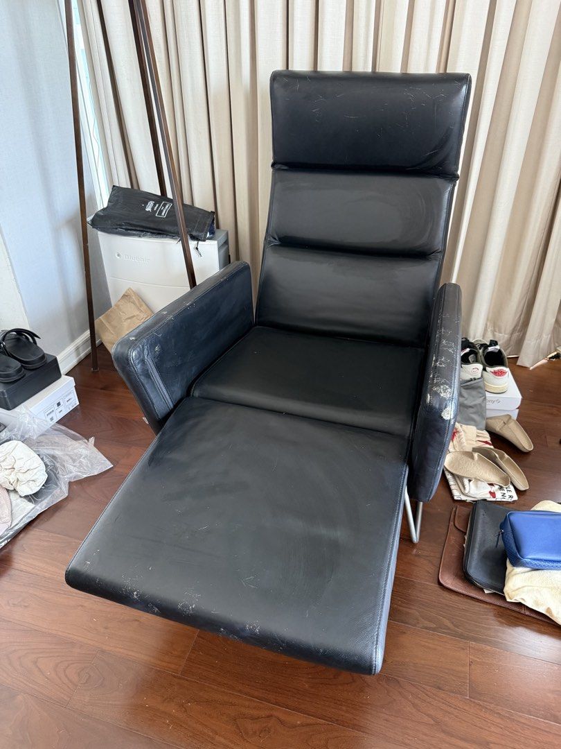 BO CONCEPT Pinto Chair (Category: Chairs) located in Pasig City. Submitted by yoshiuy (Listing ID 1468859225, Image 2). Description: - Type: Black leather high-back armchair - Features: Adjustable footrest and sturdy metal legs - Condition: Visible wear and tear, scuffs, and peeling on the leather (especially on armrests, seat edge, and footrest) - Functionality: Still very sturdy and works perfectly - Perfect budget find for a study, room, or of
