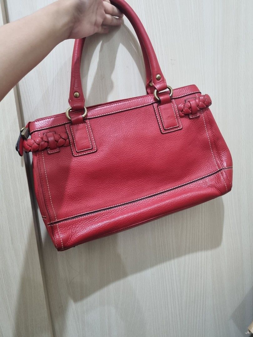 Braided Red Leather Handbag (Category: Shoulder Bags) located in Quezon City. Submitted by gabdclutz (Listing ID 1468839399, Image 2). Description: - Color: Bright Red - Material: Genuine leather with contrast white stitching - Features: Structured double handles, braided leather trim, and playful tassel charm - Hardware: Brass-tone accents - Storage: Spacious interior, perfect for daily essentials - Condition: Clean and sturdy build DIRECT PAYME