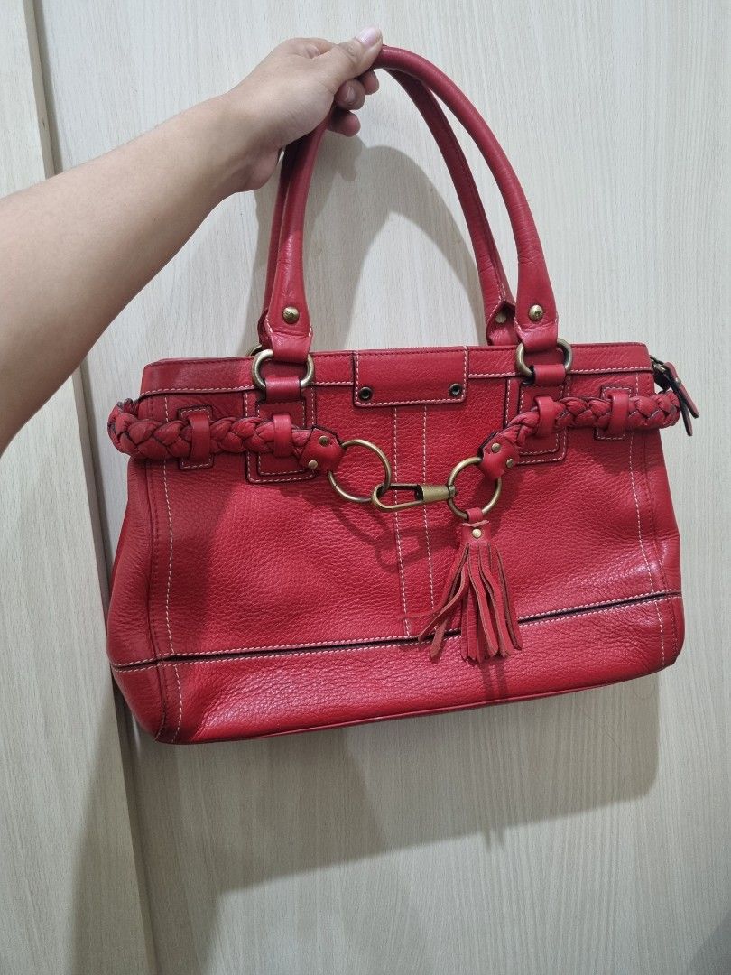Braided Red Leather Handbag (Category: Shoulder Bags) located in Quezon City. Submitted by gabdclutz (Listing ID 1468839399, Image 1). Description: - Color: Bright Red - Material: Genuine leather with contrast white stitching - Features: Structured double handles, braided leather trim, and playful tassel charm - Hardware: Brass-tone accents - Storage: Spacious interior, perfect for daily essentials - Condition: Clean and sturdy build DIRECT PAYME