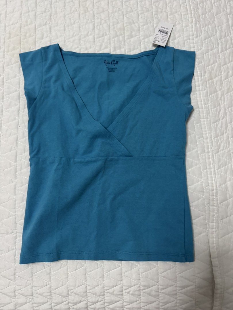 Brandy John Galt Blue V-Neck Cap Sleeve Amara Top (Category: Sleeveless) located in Manila. Submitted by mattigarciaa (Listing ID 1468759854, Image 1). Description: - Brand: John Galt - Color: Blue - Style: Crossover V-neckline with cap sleeves - Fit: Fitted silhouette through the body - Condition: Brand new with original store tag attached.