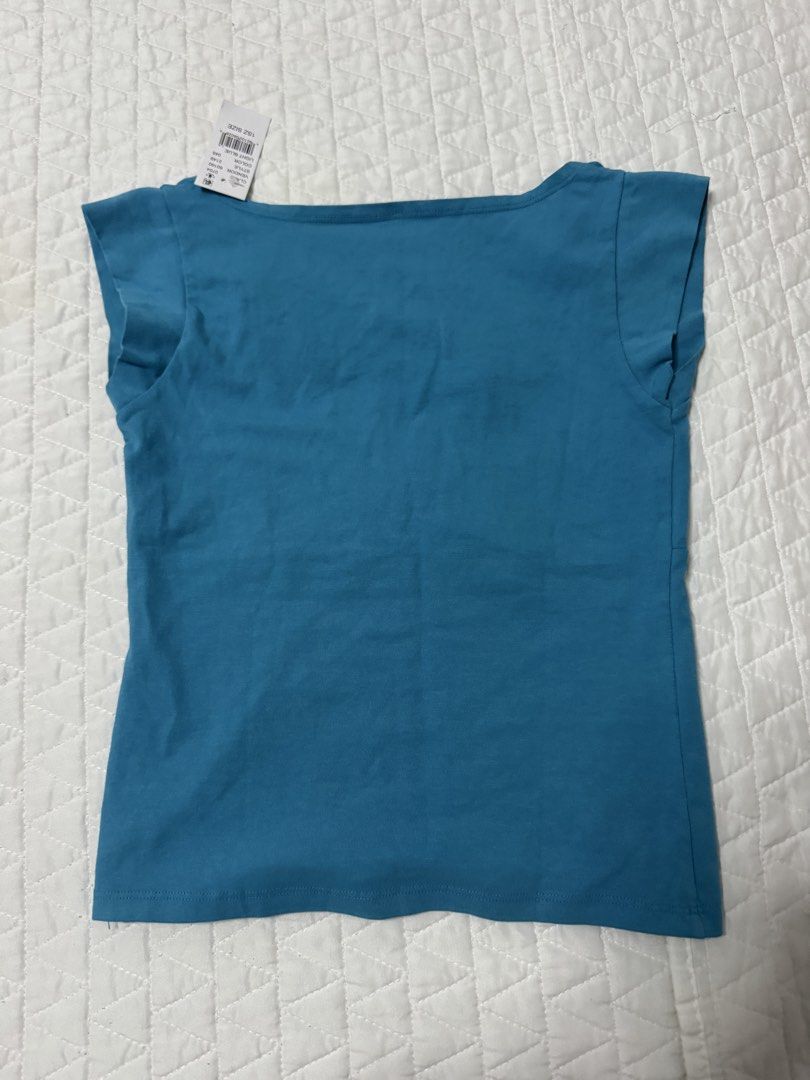 Brandy John Galt Blue V-Neck Cap Sleeve Amara Top (Category: Sleeveless) located in Manila. Submitted by mattigarciaa (Listing ID 1468759854, Image 2). Description: - Brand: John Galt - Color: Blue - Style: Crossover V-neckline with cap sleeves - Fit: Fitted silhouette through the body - Condition: Brand new with original store tag attached.