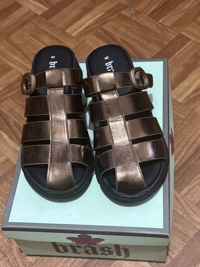 Brash Gladiator Sandals Metallic Bronze Size 9 (Category: Flats & Sandals) located in Manila. Submitted by nykji96 (Listing ID 1468714876, Image 1). Description: - Brand: Brash - Style: Gladiator platform sandals with multiple straps and side buckle accent - Color: Metallic bronze - Size: US 9 (fits true to size) - Sole: Chunky platform - Inclusions: Original shoebox - Condition: Well-kept and ready to wear.