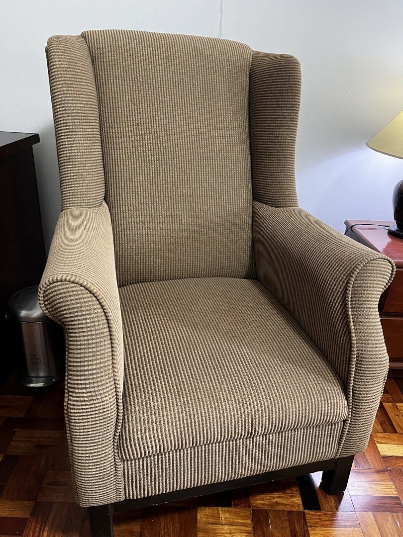 Brown Corduroy Wingback Armchair (Category: Chairs) located in Makati City. Submitted by andoypakoykoy (Listing ID 1468921174, Image 2). Description: - Brown corduroy upholstery with clean vertical ribbing - High backrest and wide armrests for ultimate comfort - Sturdy solid construction with dark wood block feet - Versatile neutral earth tone, ideal for living rooms, reading corners, or studies.