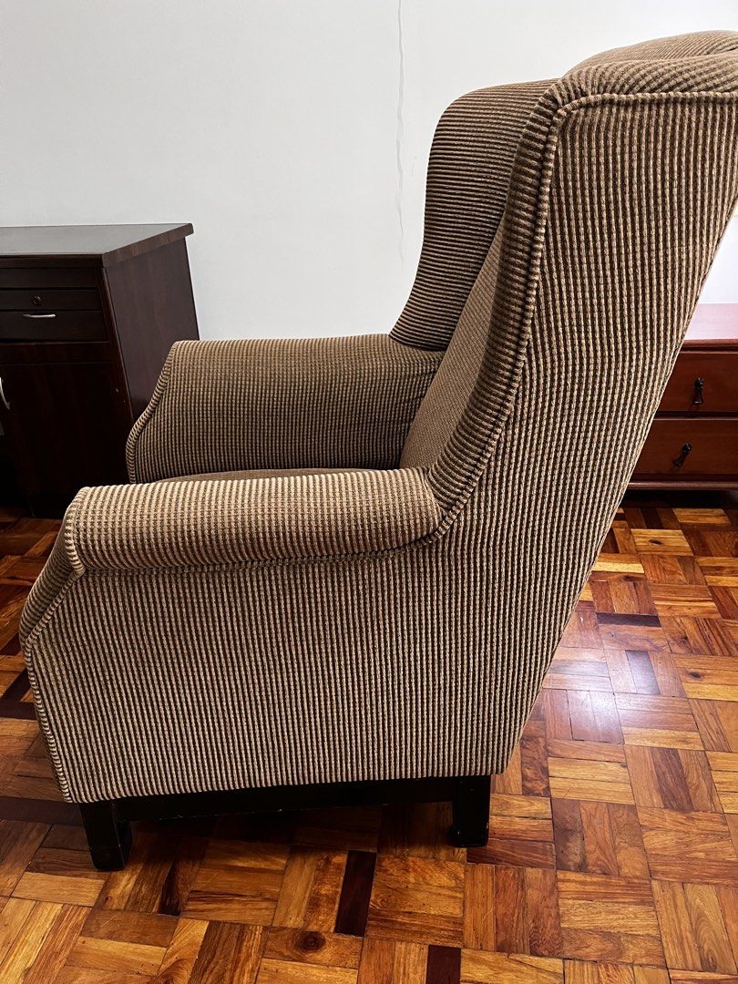 Brown Corduroy Wingback Armchair (Category: Chairs) located in Makati City. Submitted by andoypakoykoy (Listing ID 1468921174, Image 1). Description: - Brown corduroy upholstery with clean vertical ribbing - High backrest and wide armrests for ultimate comfort - Sturdy solid construction with dark wood block feet - Versatile neutral earth tone, ideal for living rooms, reading corners, or studies.