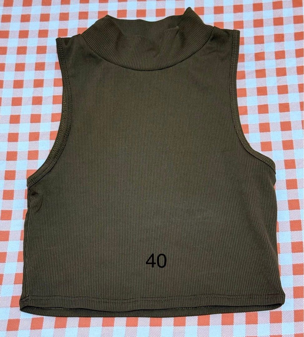 Brown Ribbed High Neck Crop Top (Category: Sleeveless) located in Quezon City. Submitted by itsmesummeeer (Listing ID 1468840514, Image 1). Description: - Color: Brown - Fabric: Stretchy ribbed knit - Design: Sleeveless with a high mock neck - Fit: Cropped length, comfortable fit - Styling: Great basic for layering or pairing with high-waisted bottoms - Size: L - 14”, W - 11”.