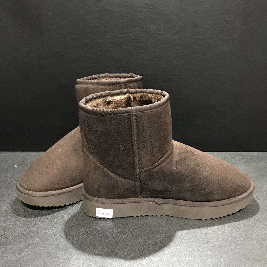 Brown suede winter boots with furry lining (Category: Boots) located in Baao. Submitted by all.things.japan (Listing ID 1468747461, Image 3). Description: - Size: 38 (indicated on sole sticker) - Material: Brown suede upper with thick plush lining - Style: Slip-on ankle boots, easy to pull on and off - Sole: Textured rubber for extra grip and safety - Condition: Great for chilly days and winter wear.