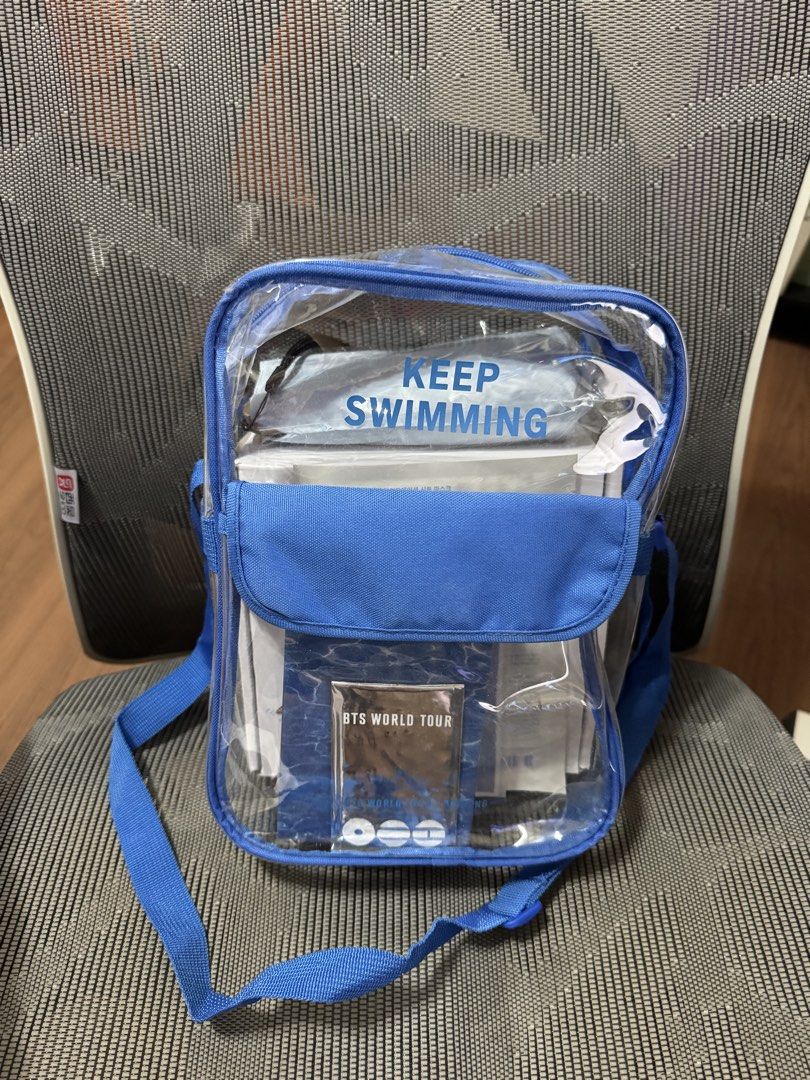BTS World Busan Tour Gift Bag (Category: Cross-body Bags) located in Pasig City. Submitted by jubinnnie (Listing ID 1468801784, Image 2). Description: - Official BTS World Tour clear blue crossbody bag - Transparent durable body to easily see inner items - Adjustable blue shoulder strap for comfortable wear - Front flap pocket with unique water pattern design and BTS World Tour card insert - Stylish blue 'Keep Swimming' lettering near the top - S