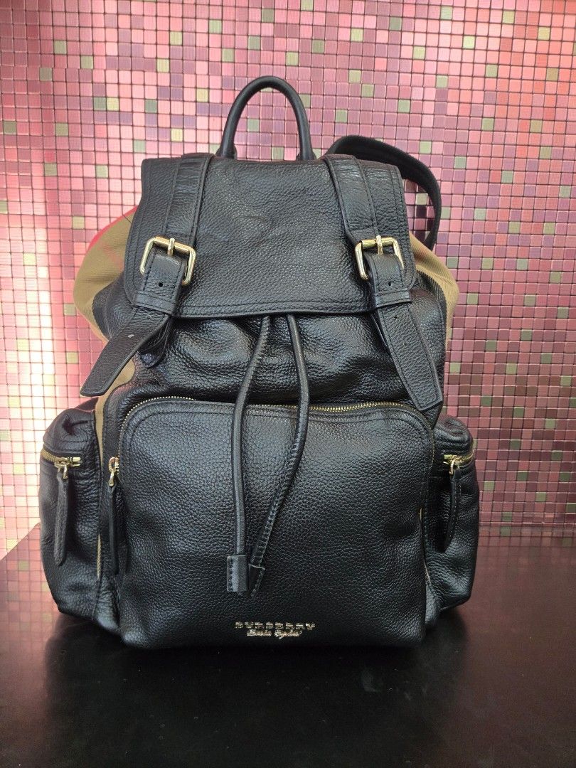Burberry Leather Backpack Large size can fit laptop (Category: Luxury Bags & Wallets) located in Manila. Submitted by pr3l0v3it3ms (Listing ID 1468834992, Image 1). Description: Burberry Backpack YKK zipper,with burberry engrave on button front and back like new condition pure leather negotiable.