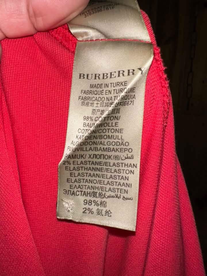 Burberry Pink Nova Check Polo Shirt (Category: Shirts) located in Luna. Submitted by wescart (Listing ID 1468873877, Image 3). Description: Size L on tag.