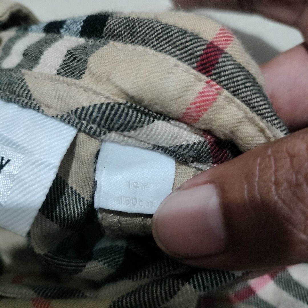 BURBERRY PLAID DRESS (Category: Luxury Apparel) located in Sariaya. Submitted by social_animalz (Listing ID 1468876415, Image 3). Description: size 14y / 150cm pit to pit: 16 top to bottom: 29.5 with 2 pockets sa front with buttons sa back ALL DETAILS POSTED, CHECK NYO NA LANG IF INTERESTED KAYO shipping fee is not included.