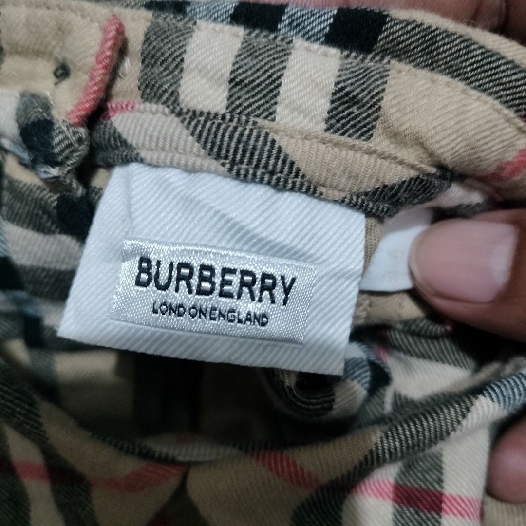 BURBERRY PLAID DRESS (Category: Luxury Apparel) located in Sariaya. Submitted by social_animalz (Listing ID 1468876415, Image 2). Description: size 14y / 150cm pit to pit: 16 top to bottom: 29.5 with 2 pockets sa front with buttons sa back ALL DETAILS POSTED, CHECK NYO NA LANG IF INTERESTED KAYO shipping fee is not included.