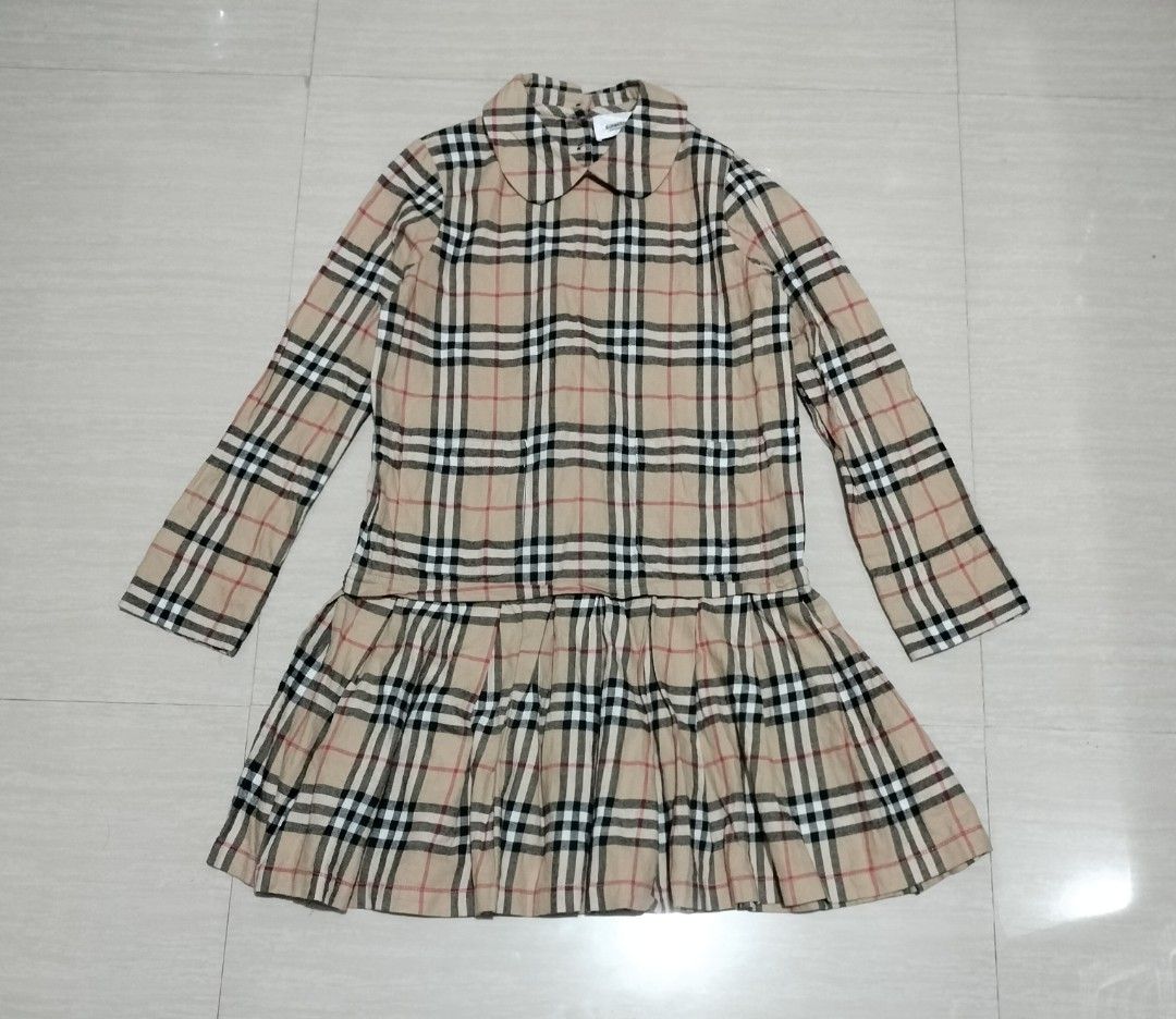 BURBERRY PLAID DRESS (Category: Luxury Apparel) located in Sariaya. Submitted by social_animalz (Listing ID 1468876415, Image 1). Description: size 14y / 150cm pit to pit: 16 top to bottom: 29.5 with 2 pockets sa front with buttons sa back ALL DETAILS POSTED, CHECK NYO NA LANG IF INTERESTED KAYO shipping fee is not included.