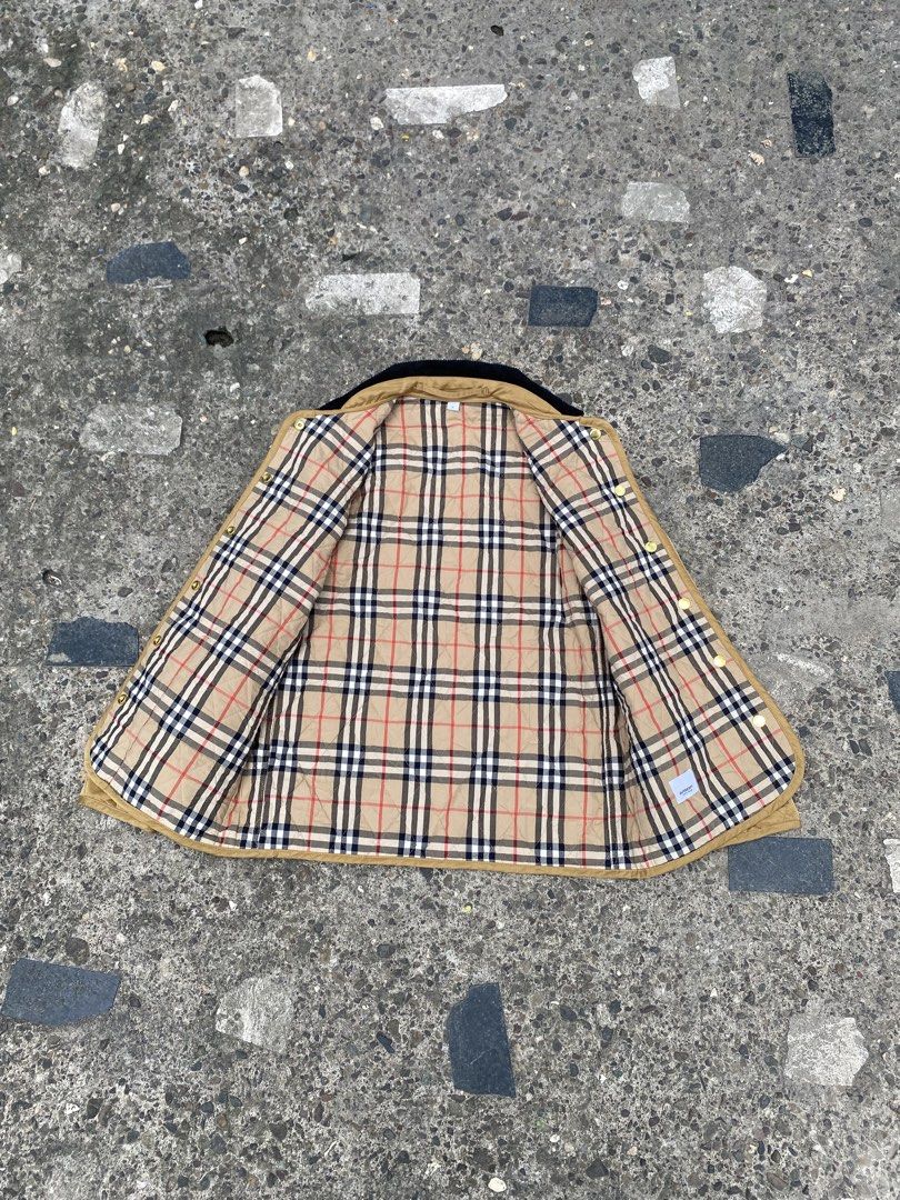 Burberry Quilted Dranefeld Barn Jacket (Category: Coats, Jackets and Outerwear) located in Caloocan City. Submitted by gaylawanna22819 (Listing ID 1468855664, Image 3). Description: - Brand: Burberry - Style: Quilted Dranefeld barn jacket - Color: Camel with black corduroy collar - Size: M (Tag at collar) - Details: Gold-tone snap button closure, two front patch pockets - Lining: Classic Burberry check - Branding: Burberry London England logo pat