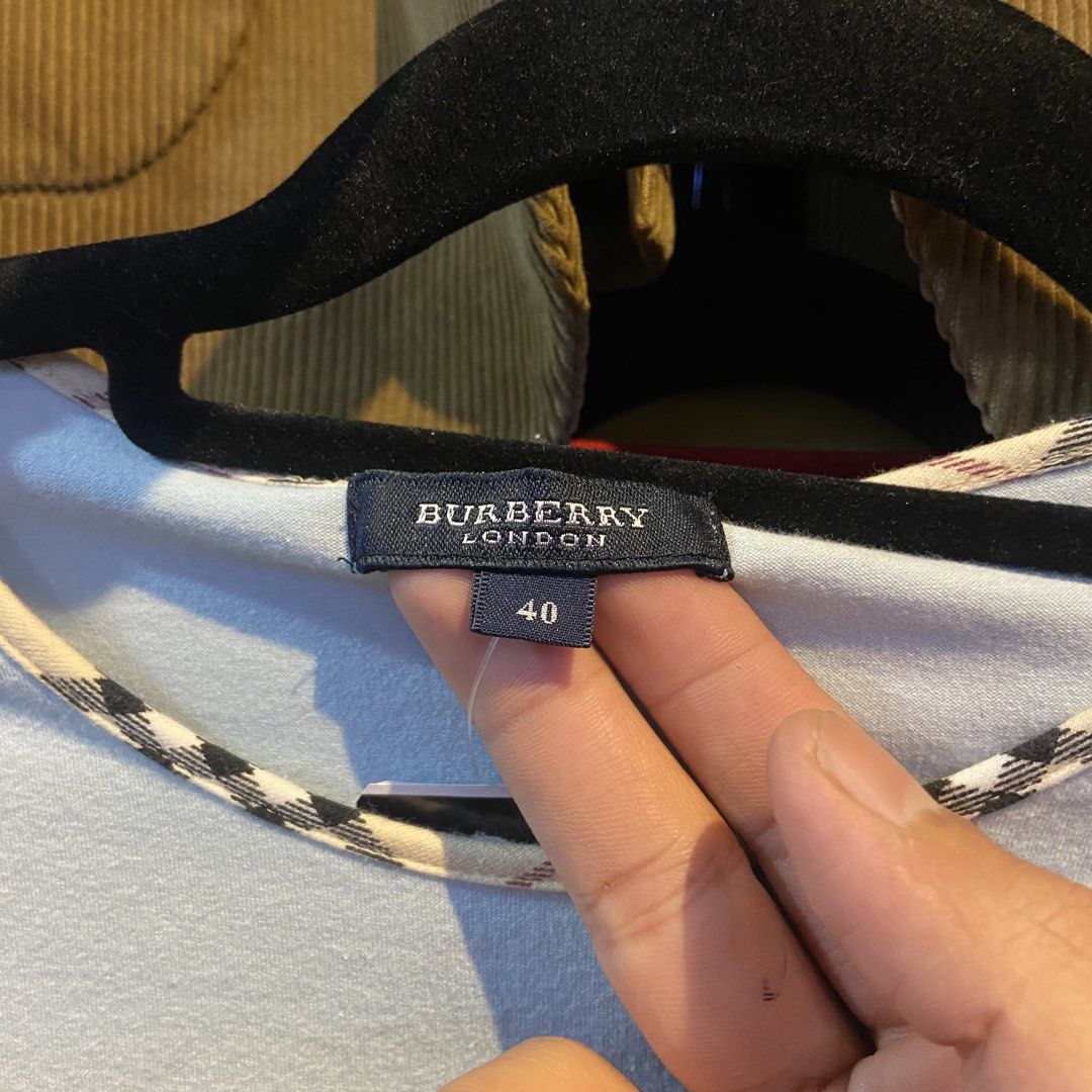 Burberry Shortsleeve Nova Checkered Neckline Top (Category: Shirts) located in Davao. Submitted by payts.wruh (Listing ID 1468915149, Image 2). Description: Burberry Shortsleeve Nova Checkered Neckline Top size 40 excellent condition no issue like new PM if interested💌.
