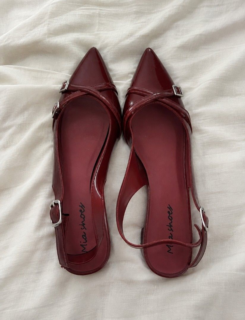 Burgundy Red Pointed Toe Slingback Heels (Category: Heels) located in Manila. Submitted by littlenicsfinds (Listing ID 1468741767, Image 2). Description: - Brand: Mia Shoes - Style: Pointed toe slingback heels with low block heel - Color/Finish: Rich maroon with a glossy patent finish - Details: Cross strap design with adjustable silver buckles - Condition: Minimal wear on soles, uppers are very clean and well-maintained - Comfort: Perfect for da