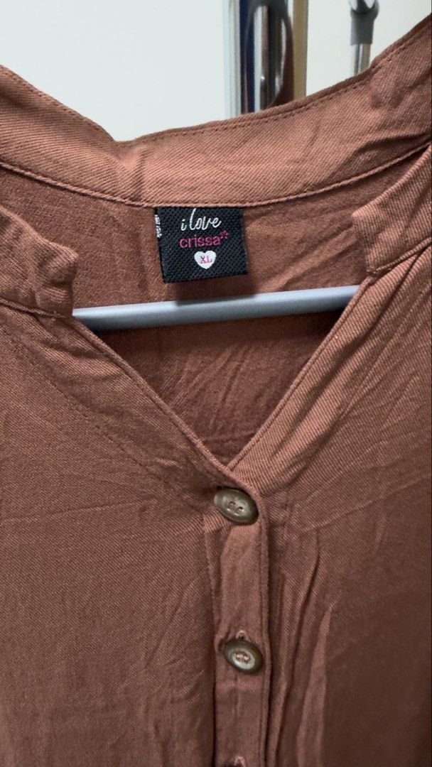Button down dress XL (Category: Dresses) located in Manila. Submitted by rare_closetcleanout (Listing ID 1468798814, Image 2). Description: - Brand: I Love Crissa - Size: Fits L-XL - Color: Brown - Style: Midi dress with short sleeves and V-neckline - Details: Front button placket, gathered waist, and tiered skirt - Fabric: Lightweight, comfortable, and perfect for casual days 44cm length Decluttering MOP- Gcash Pls arrange own collection BGG .