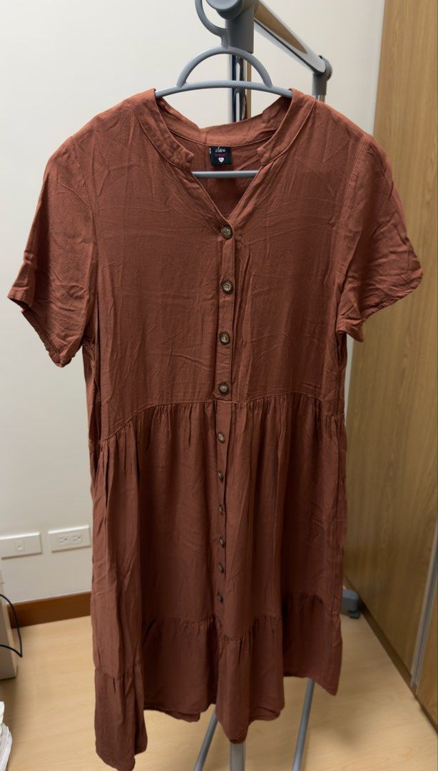 Button down dress XL (Category: Dresses) located in Manila. Submitted by rare_closetcleanout (Listing ID 1468798814, Image 1). Description: - Brand: I Love Crissa - Size: Fits L-XL - Color: Brown - Style: Midi dress with short sleeves and V-neckline - Details: Front button placket, gathered waist, and tiered skirt - Fabric: Lightweight, comfortable, and perfect for casual days 44cm length Decluttering MOP- Gcash Pls arrange own collection BGG .