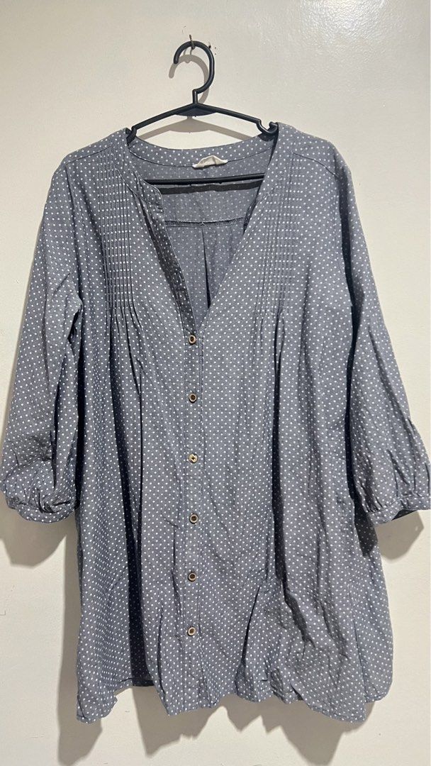 Button Down Office Blouse (Category: Blouses) located in Cabuyao City. Submitted by calmstorm.0108 (Listing ID 1468835496, Image 1). Description: - Style: Grey polka dot blouse with a flattering V-neck and button-down front - Details: Elegant pleated front panels - Sleeves: Three-quarter sleeves - Fit: Relaxed and comfortable - Fabric: Lightweight and breathable - Versatility: Perfect for both casual weekends and office wear.