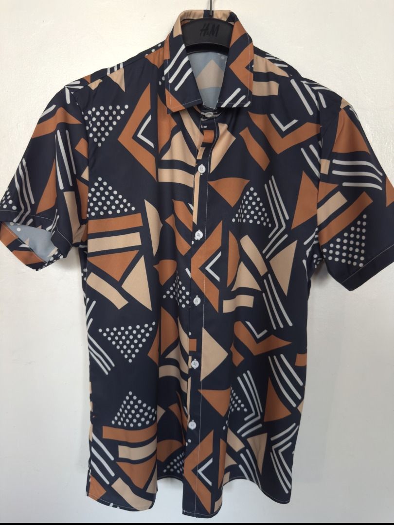 Button Up Polo (Category: Tshirts & Polo Shirts ) located in Vigan. Submitted by potcholo. (Listing ID 1468865287, Image 1). Description: Geo Graphic Printed Button Up Polo Size: MEDIUM to SEMI LARGE 22 x 30 359 pesos only Very good condition.