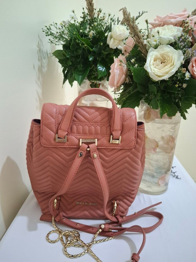 Bvlgari Serpenti Quilted Leather Backpack Dusty Pink (Category: Backpacks) located in Manila. Submitted by eclat_delicat (Listing ID 1468721545, Image 2). Description: - Brand: Bvlgari - Material & Color: Dusty pink quilted leather with purple inner lining - Closure: Iconic snakehead front flap and secure drawstring - Straps: Adjustable for comfort - Compartments: Interior zipper pocket for essentials - Inclusions: Original dust bag and protectiv