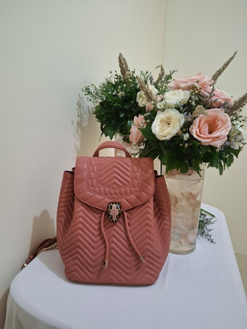 Bvlgari Serpenti Quilted Leather Backpack Dusty Pink (Category: Backpacks) located in Manila. Submitted by eclat_delicat (Listing ID 1468721545, Image 1). Description: - Brand: Bvlgari - Material & Color: Dusty pink quilted leather with purple inner lining - Closure: Iconic snakehead front flap and secure drawstring - Straps: Adjustable for comfort - Compartments: Interior zipper pocket for essentials - Inclusions: Original dust bag and protectiv