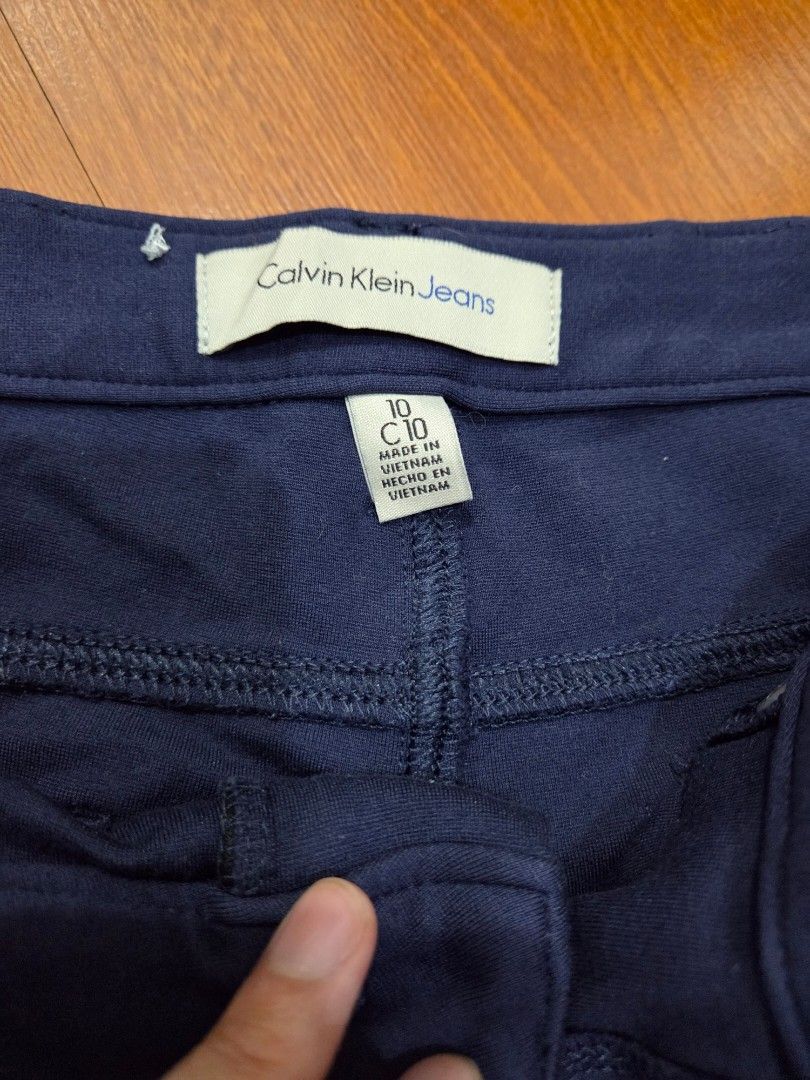 Calvin Klein Jeans Blue Pants Size 10 (Category: Jeans) located in Taguig. Submitted by mon_143 (Listing ID 1468909541, Image 3). Description: - Brand: Calvin Klein Jeans - Size: 10 (Tag inside) - Color: Dark Blue - Origin: Made in Vietnam - Material: Thick, textured fabric with stretch for comfort - Closure: Zip fly with button closure and belt loops - Pockets: Two back pockets featuring a signature stitched logo design - Condition: Excellent / 