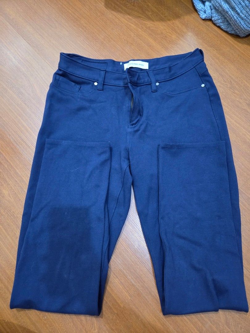 Calvin Klein Jeans Blue Pants Size 10 (Category: Jeans) located in Taguig. Submitted by mon_143 (Listing ID 1468909541, Image 1). Description: - Brand: Calvin Klein Jeans - Size: 10 (Tag inside) - Color: Dark Blue - Origin: Made in Vietnam - Material: Thick, textured fabric with stretch for comfort - Closure: Zip fly with button closure and belt loops - Pockets: Two back pockets featuring a signature stitched logo design - Condition: Excellent / 