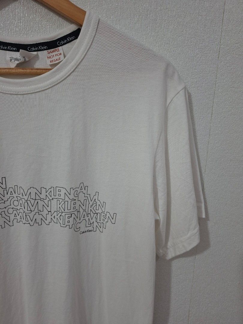 Calvin Klein multiple logo script (Category: Tshirts & Polo Shirts ) located in Cavite. Submitted by labbudds20 (Listing ID 1468926562, Image 3). Description: Calvin Klein multiple script logo design sample piece size medium armpit to armpit 20 inches length 30 inches like new condition see pictures for details.