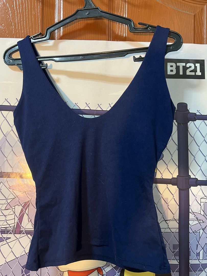 Candy Navy Blue V-Neck Tank Top Medium (Category: Sleeveless) located in Marikina City. Submitted by yssacee (Listing ID 1468913769, Image 2). Description: - Brand: Candy - Color: Navy blue - Size: Medium - Design: Deep V-neck with wide straps - Material: Soft stretch fabric for a comfortable fit, with inner pads included - Style: Versatile everyday basic, perfect for pairing with jeans or skirts - shipping from lower antipolo rizal - pm for more