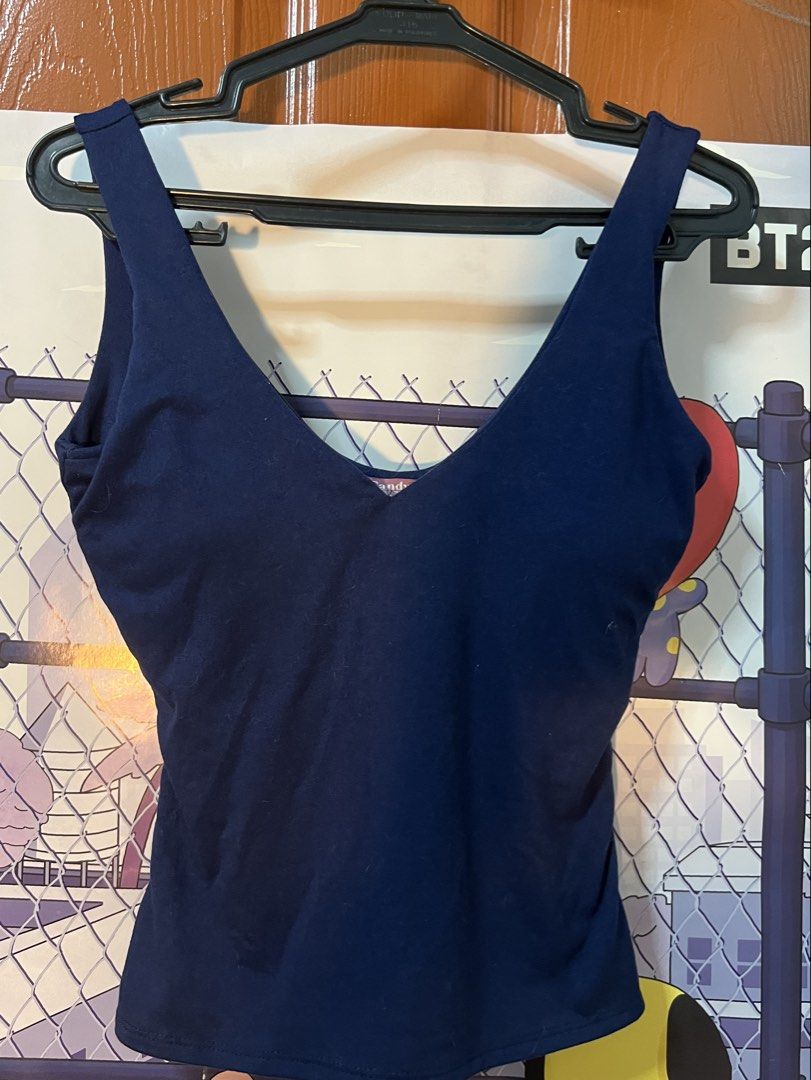 Candy Navy Blue V-Neck Tank Top Medium (Category: Sleeveless) located in Marikina City. Submitted by yssacee (Listing ID 1468913769, Image 1). Description: - Brand: Candy - Color: Navy blue - Size: Medium - Design: Deep V-neck with wide straps - Material: Soft stretch fabric for a comfortable fit, with inner pads included - Style: Versatile everyday basic, perfect for pairing with jeans or skirts - shipping from lower antipolo rizal - pm for more