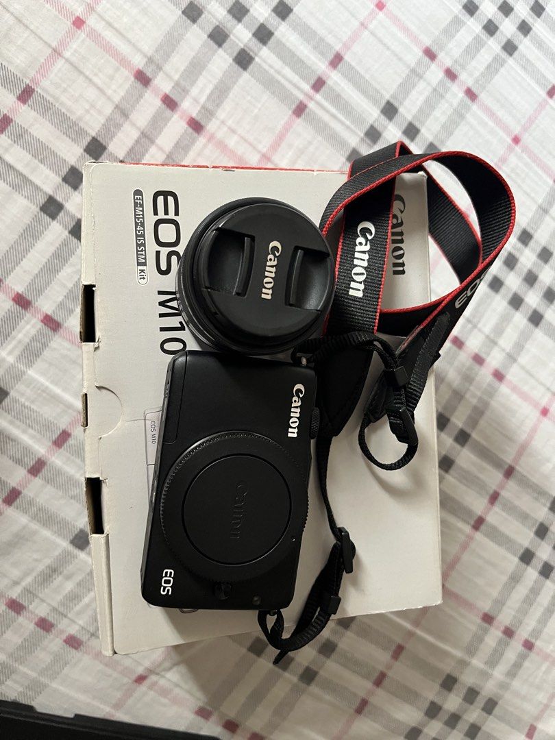Canon EOS M10 Mirrorless Camera with 15-45mm Lens (Category: Cameras) located in Makati City. Submitted by ojala (Listing ID 1468730488, Image 2). Description: - Canon EOS M10 mirrorless camera body (Black) - EF-M 15-45mm f/3.5-6.3 IS STM zoom lens included - Tilt-up screen great for selfies and vlogging - Compact, lightweight, and user-friendly design - Comes complete with original camera strap, battery charger, and factory box Pefect for travel