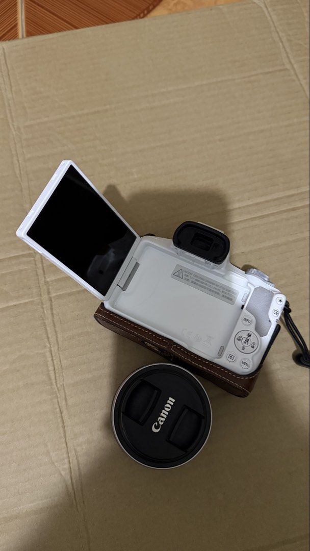 Canon EOS R50 (Category: Cameras) located in Santa Rosa. Submitted by m.adel (Listing ID 1468739574, Image 3). Description: - Model: White Canon EOS R50 mirrorless camera body with included Canon kit lens - Features: Fully articulating flip-out screen, ideal for vlogging and selfies - Condition: Clean exterior body, well-maintained and travel-ready - Ready to use: Complete set with box Rfs: need funds.