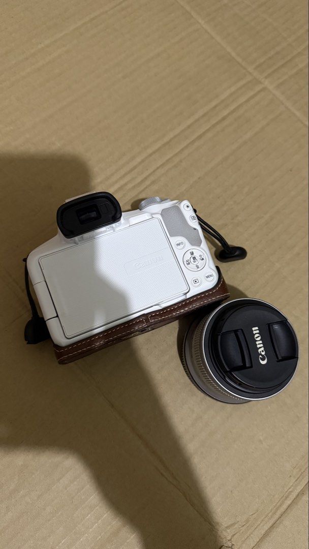Canon EOS R50 (Category: Cameras) located in Santa Rosa. Submitted by m.adel (Listing ID 1468739574, Image 2). Description: - Model: White Canon EOS R50 mirrorless camera body with included Canon kit lens - Features: Fully articulating flip-out screen, ideal for vlogging and selfies - Condition: Clean exterior body, well-maintained and travel-ready - Ready to use: Complete set with box Rfs: need funds.