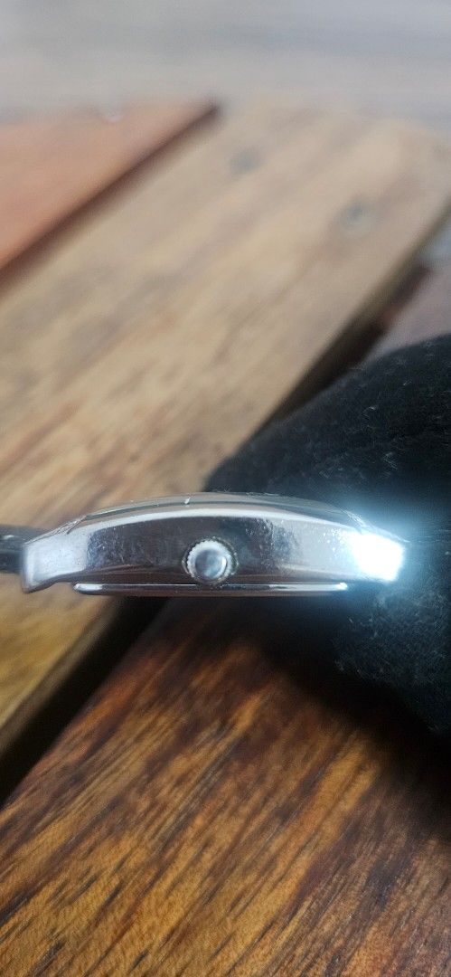 Caravelle by Bulova Watch (Category: Women's Watches) located in Santa Maria. Submitted by rommelmateo (Listing ID 1468861758, Image 2). Description: - Brand: Caravelle by Bulova - Dial: Silver with large numbers at 12, 3, 6, and 9 - Bezel: Rhinestone-encrusted top and bottom - Case: Curved rectangular stainless steel (standard light scuffs on the back from normal wear) - Strap: Textured black leather - Condition: Keeps time very well.