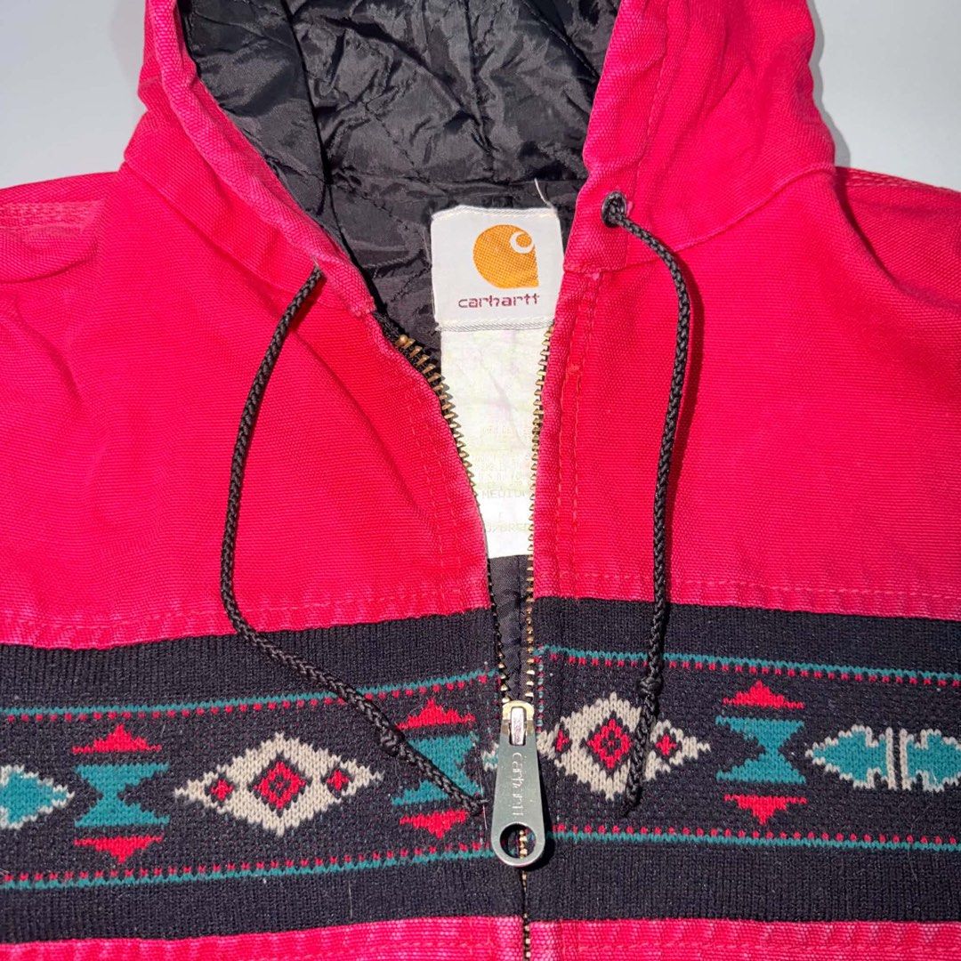 Carhartt Aztec Patterned Hooded Zip Activr Jacket (Category: Coats, Jackets and Outerwear) located in Santa Rosa. Submitted by n.vallermosa (Listing ID 1468920142, Image 2). Description: J78 red aztec active Medium 22.5x27 Issues: signs of usage, expired patch, scratch on left ribbings Price 45000 or obo - Brand: Carhartt - Color: Bright red with black Aztec pattern stripe - Material: Heavy cotton canvas with quilted black lining - Features: Full