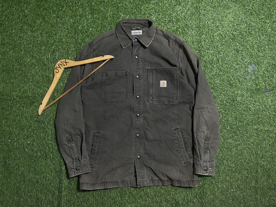 Carhartt Lined Shirt Jacket Dark Grey Size M (Category: Coats, Jackets and Outerwear) located in Las Pinas. Submitted by jynxdefant26140 (Listing ID 1468899512, Image 1). Description: - Brand: Carhartt - Type: Button-up shirt jacket / Overshirt - Color: Dark grey canvas with purple plaid flannel lining - Size: Medium (Regular fit) - Material: Cotton and spandex blend (durable with slight stretch) - Pockets: Dual chest pockets with snap buttons + 