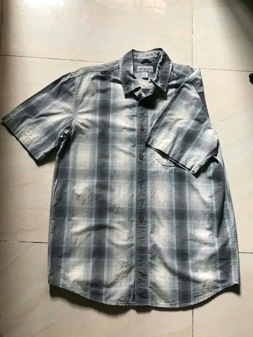 Carhartt Plaid Button Up Shirt (Category: Tshirts & Polo Shirts ) located in Paranaque City. Submitted by genxie_ (Listing ID 1468791824, Image 2). Description: Size: M on Tag Dimes: 27.5 x 29 Original/Authentic Carhartt Location: Parañaque City Color Rate: 10/10 no fading or any discoloration. PM IF INTERESTED!.