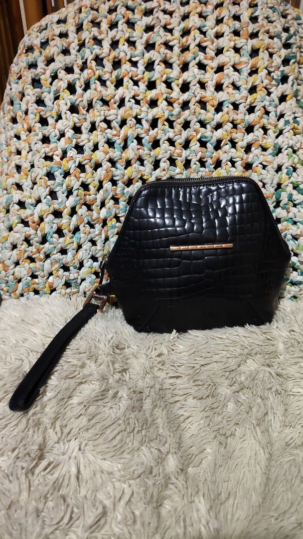 Carlyn Black Croc Embossed Wristlet Handbag (Category: Purses & Pouches) located in Cebu City. Submitted by lumaynojes00490 (Listing ID 1468800481, Image 3). Description: - Color: Classic Black with sophisticated rose gold hardware - Texture: Stylish all-over croc-embossed design - Shape: Trendy and structured hexagonal silhouette - Closure: Secure top-zip closure - Convenience: Comes with an attached wrist strap for easy carrying - Capacity: Com