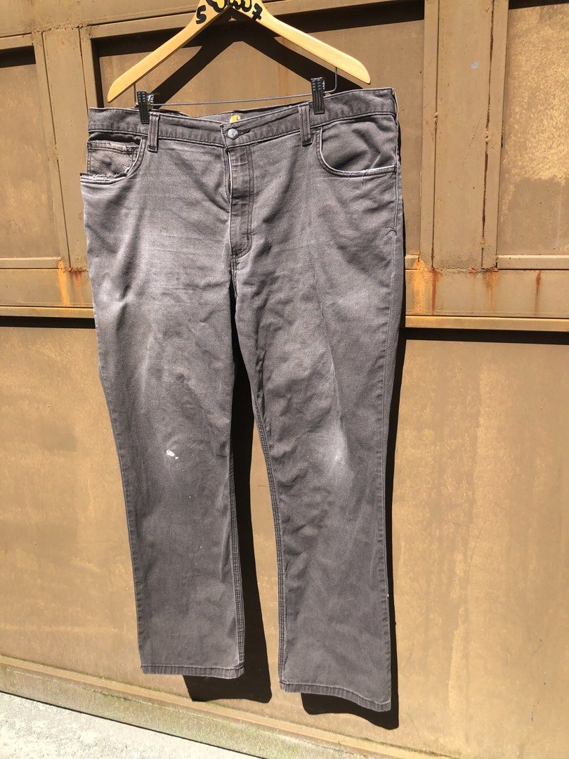 Carousell Carhartt Grey Utility Work Pants (Category: Jeans) located in Manila. Submitted by yocsthrifted (Listing ID 1468830979, Image 2). Description: - Brand: Carhartt - Item: Utility work pants - Color: Washed grey - Details: Multiple tool pockets with classic logo patch - Condition: Shows natural fading, wear marks, and authentic paint splatters from actual work use - Features: Tough, durable fabric built for daily tasks.