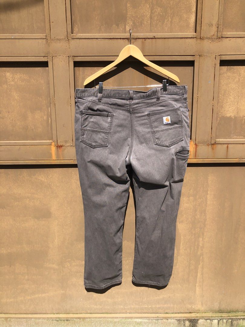 Carousell Carhartt Grey Utility Work Pants (Category: Jeans) located in Manila. Submitted by yocsthrifted (Listing ID 1468830979, Image 3). Description: - Brand: Carhartt - Item: Utility work pants - Color: Washed grey - Details: Multiple tool pockets with classic logo patch - Condition: Shows natural fading, wear marks, and authentic paint splatters from actual work use - Features: Tough, durable fabric built for daily tasks.
