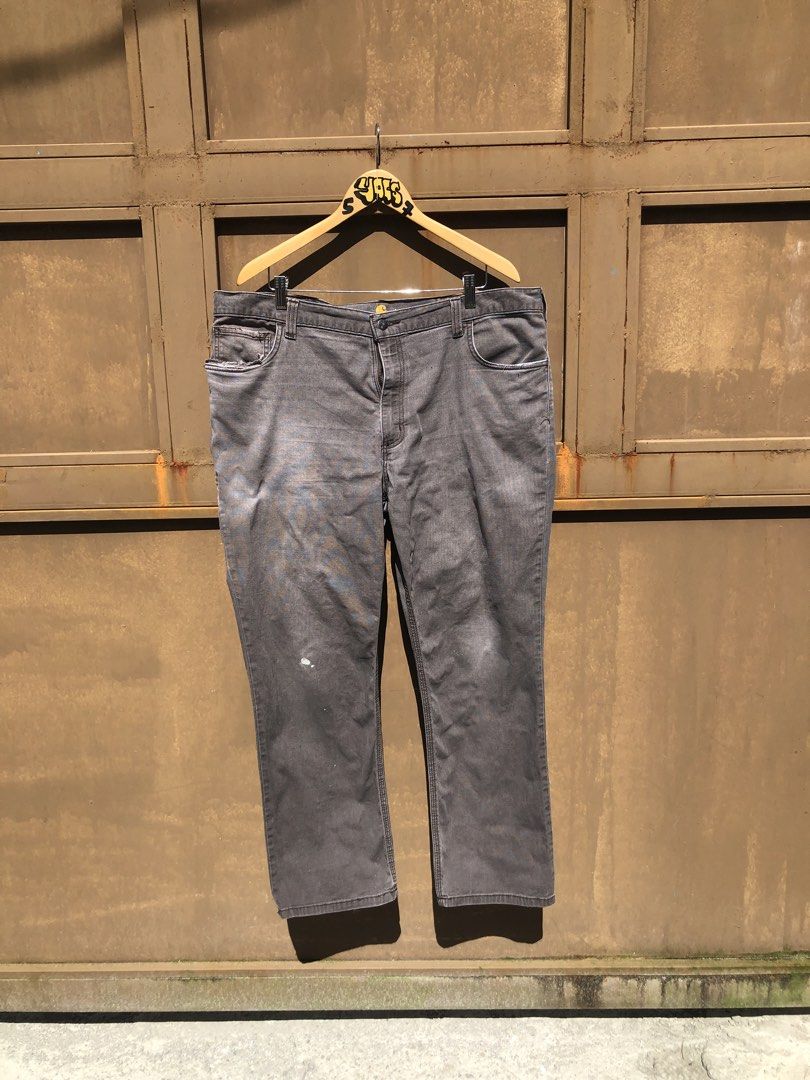 Carousell Carhartt Grey Utility Work Pants (Category: Jeans) located in Manila. Submitted by yocsthrifted (Listing ID 1468830979, Image 1). Description: - Brand: Carhartt - Item: Utility work pants - Color: Washed grey - Details: Multiple tool pockets with classic logo patch - Condition: Shows natural fading, wear marks, and authentic paint splatters from actual work use - Features: Tough, durable fabric built for daily tasks.