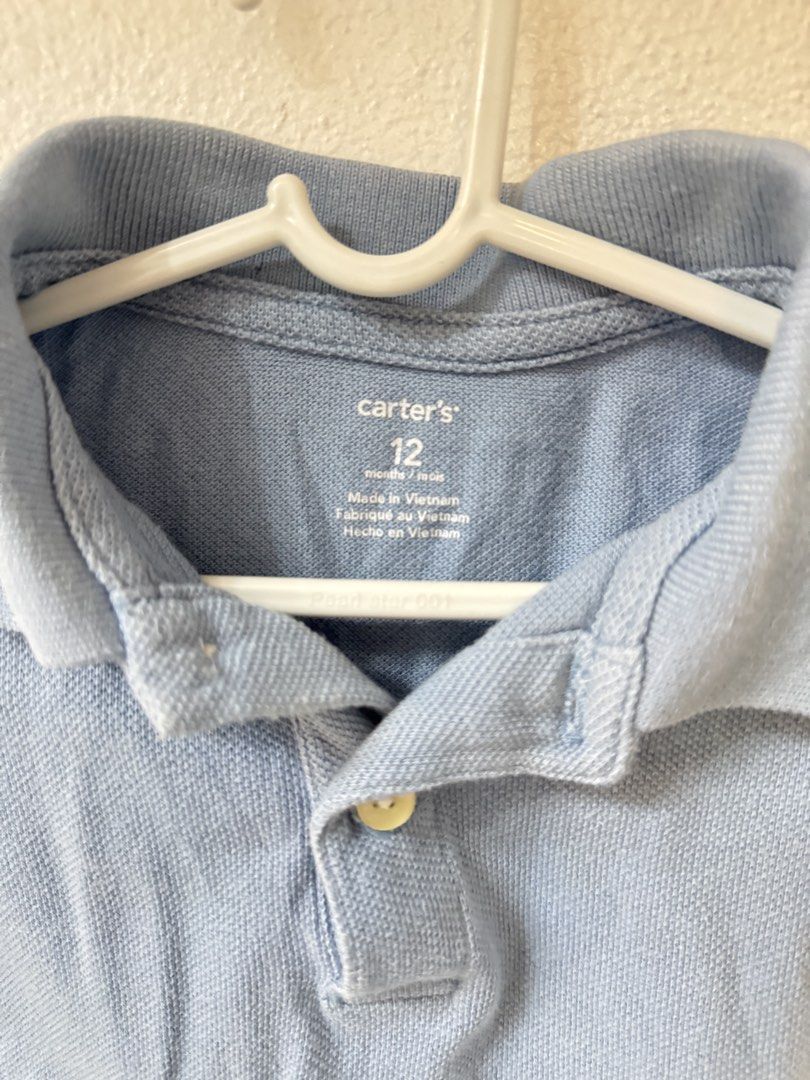 Carter's Blue Polo Bodysuit 12 Months (Category: Babies & Kids Fashion) located in Manila. Submitted by janelica220598 (Listing ID 1468820557, Image 2). Description: - Brand: Carter's - Item: Light blue polo bodysuit - Size: 12 months - Material: Textured cotton knit - Features: Short sleeves, classic collar with single-button placket, 3-snap bottom closure for easy diaper changes - Condition: Excellent / Preloved - Made in: Vietnam.