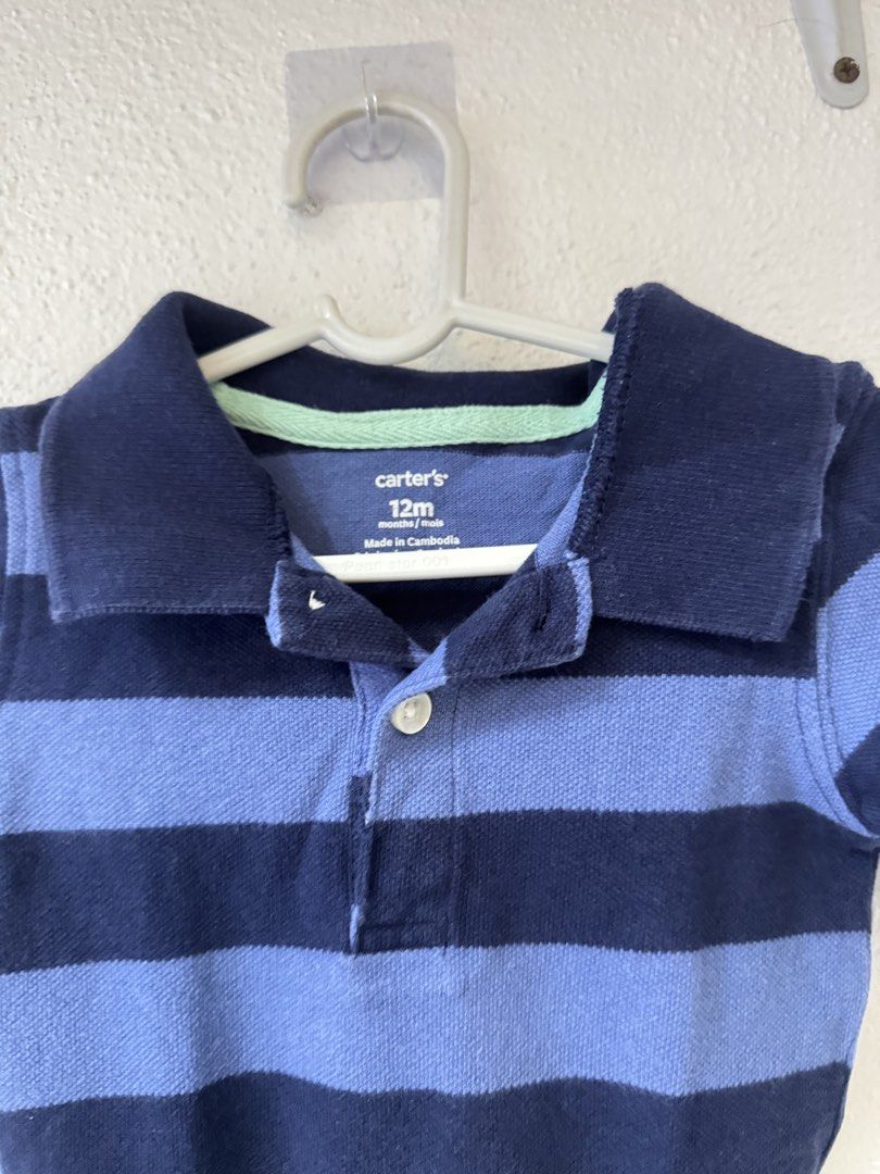 Carter's striped polo bodysuit 12m (Category: Babies & Kids Fashion) located in Manila. Submitted by janelica220598 (Listing ID 1468820417, Image 2). Description: - Brand/Model: Carter's Baby Polo Bodysuit - Size: 12 Months - Design: Multi-color horizontal stripes (Navy blue, light blue, mint green, white, pink) - Features: Short sleeves, traditional collar, single white button placket at the chest - Origin: Made in Cambodia - Perfect for daily w
