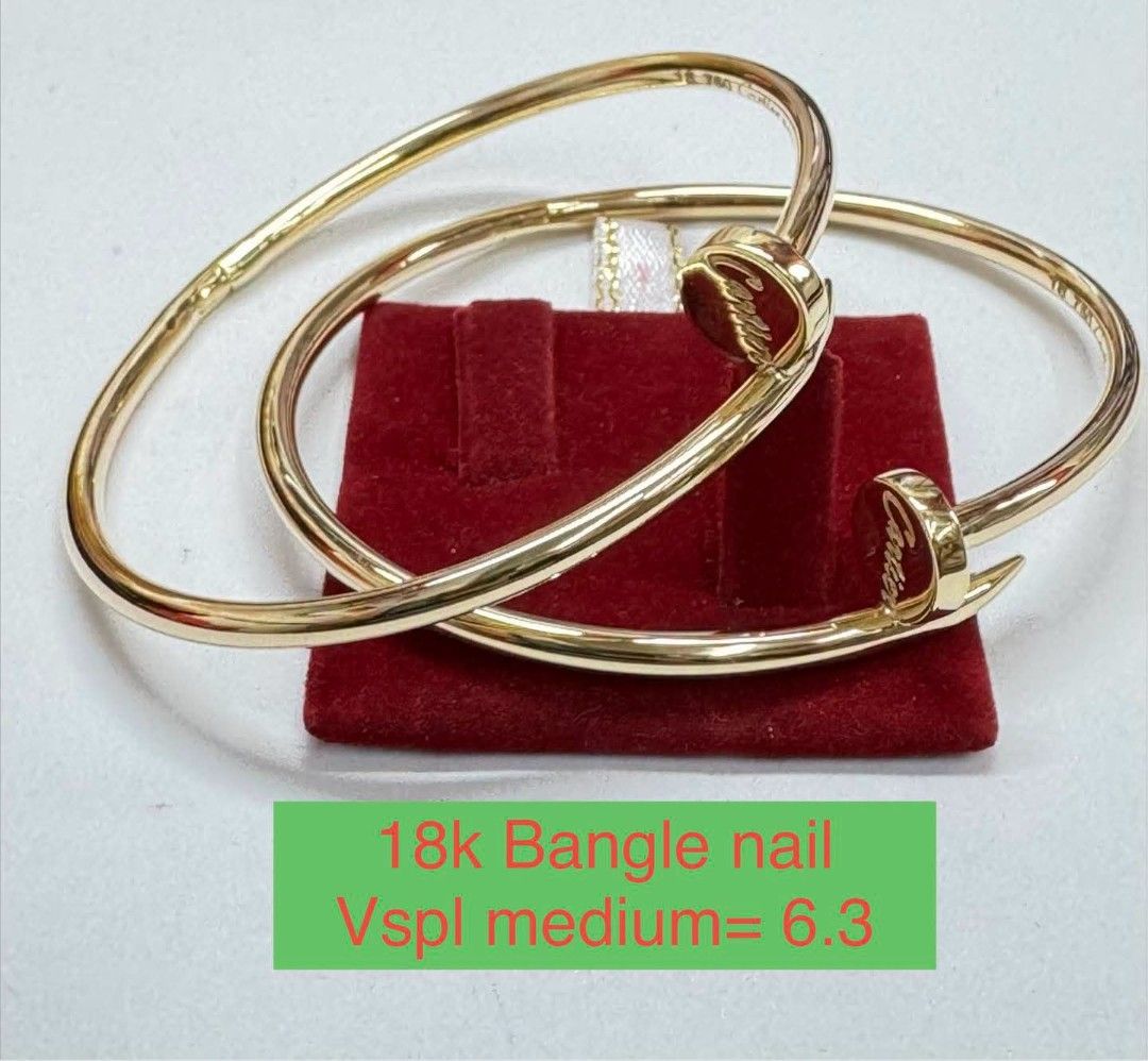 Cartier Nail Bangle 18k Yellow Gold Medium 6.3 (Category: Bracelets) located in Marikina City. Submitted by jhem.andcojewelry (Listing ID 1468713541, Image 1). Description: - Brand: Cartier Nail Bangle - Material: 18k Yellow Gold - Size: Medium (6.3 inches) - Design: Iconic nail silhouette with engraved Cartier logo on the head - Condition: Excellent with heavy gold shine - Inclusions: Comes with a red display stand - Style: Timeless luxury acces